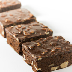 Pieces of fresh brownie on white background. 