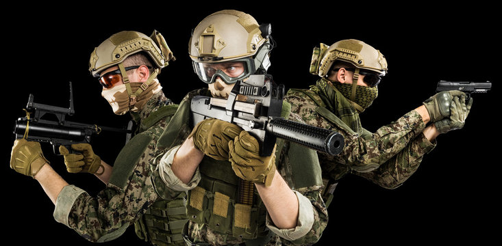 Male in uniform of Tactical Units of Police with submachine gun P90. Shot in studio. Isolated with clipping path on black background