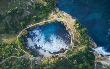 destroyed rocks and a Bay with an arch on an island in the Indian ocean a broken beach