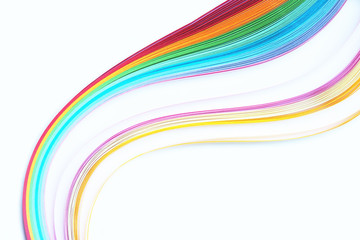 Quilling, strips of colored paper on white background, rainbow