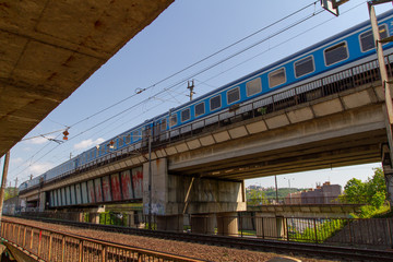 Obraz premium an old railway tunnel for trains in the Czech city and a bridge for trains next to it