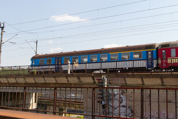 
old railway bridge for trains in the Czech city and tracks next to it