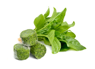 Fresh and Frozen Spinach leaves. Isolated on white background