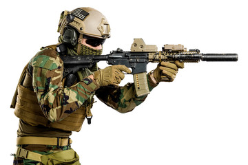 US marine corps soldier with rifle. Shot in studio. isolated with clipping on white background.