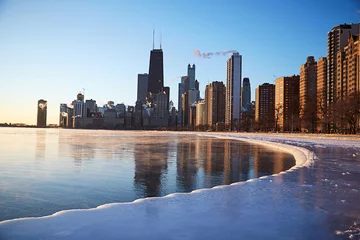 Tuinposter A view from the frozen lakefront of the beautiful downtown chicago skyline on a subzero winter morning sunrise © Donte