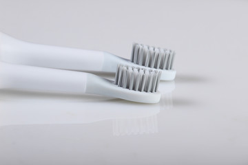 Two toothbrushes on a white background