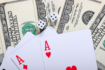 Aces of playing cards with dice and hundred dollar bills. Game addiction. Gambling, casino