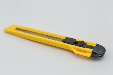 Office plastic knife for cut paper and other, closeup