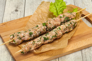 Raw minced pork skewer kebab for grill