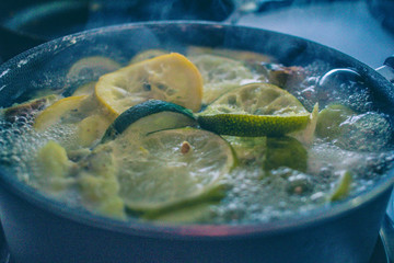 boiling lemon, limes, orange and pineapples for tea