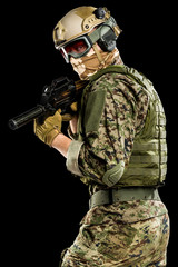 Fototapeta premium US marine corps soldier with weapon. Shot in studio. isolated with clipping on black background.