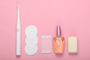 Beauty, health care, bath products and accessories on a pink background. Flat lay. Top view