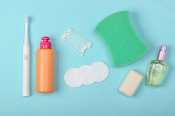 Beauty, health care, cosmetics, hygiene product on blue background. Flat lay. Top view