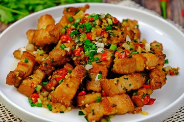 Stir fried pork belly slice with chilli and salt.