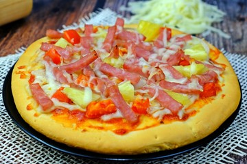 Homemade pizza ready to be served on a plate.