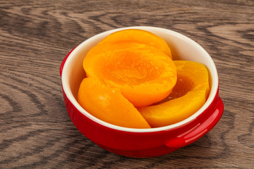 Marinated peaches fruit in the bowl