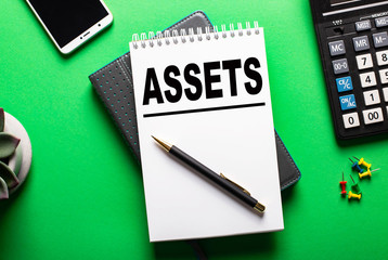 Assets planning on a sheet of paper on a green background