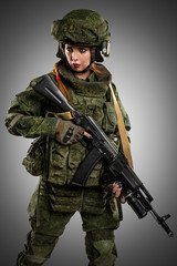 female in russian mechanized infantry uniform on grey background.