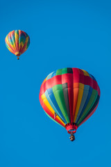 Fototapeta na wymiar Colorful Hot Air Balloons In Flight At The Pahrump BalloonFest, Pahrump, Nevada, USA