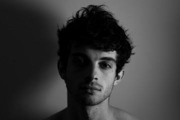 Black and white Man looking camera curly hair cute affraid