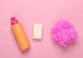 Bath, beauty products on a pink background. Shower gel bottle, sponge, soap. Top view. Flat lay