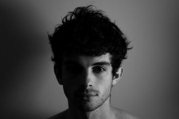 Black and white Man looking camera curly hair cute affraid