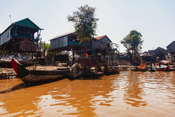 Fototapeta na wymiar Tonle SAP, Cambodia - February 2014: Kampong Phluk village during drought season. Life and work of residents of Cambodian village on water, near Siem Reap, Cambodia