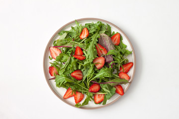 Delicious healthy salad of fresh  strawberries and arugula