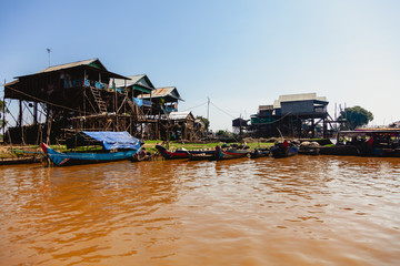 Fototapeta na wymiar Tonle SAP, Cambodia - February 2014: Kampong Phluk village during drought season. Life and work of residents of Cambodian village on water, near Siem Reap, Cambodia