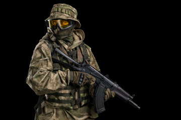 Special forces soldier with rifle. Shot in studio. Isolated with clipping path on black background.
