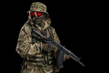 Fototapeta premium Special forces soldier with rifle. Shot in studio. Isolated with clipping path on black background.
