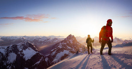 Fantasy Adventure Composite Image of Man and Woman Mountaineering up Snow with Mountain Peaks in...