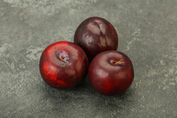 Ripe sweet plum fruit heap