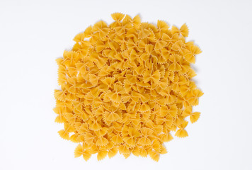 Italian pasta Farfalle. Pasta bows on white background. Top view