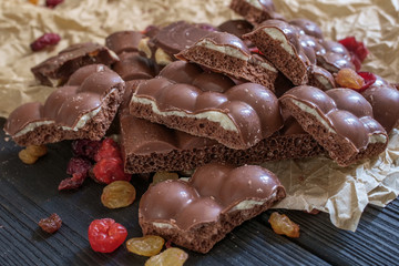 close up of milk chocolate  with sec fruits