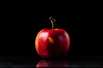 Red apple on a black background

