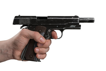 Legendary U.S. Army handgun Colt 1911A1 in male hand isolated on white background. Military model...