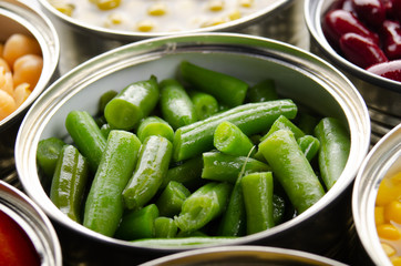 Canned green beans in just opened tin can. Non-perishable food