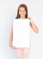 Portrait of a happy teenager girl with a blank canvas board