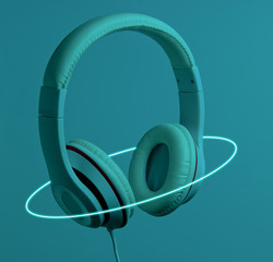 Retro wave. Headphones in neon light with a luminous led oval. 80s