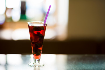 Pink cocktail with ice and mint, selective focus