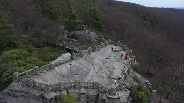 Aerial camera orbiting to the left with closeup of the Coopers Rock overlook.