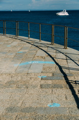Footprint sign blue color with text keep your distance at least two metres - social distancing...