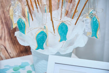 Animal shaped (fish) cookies (or biscuits) glazed with blue colored sugar. Tasty and easy homemade for fun celebrations or birthdays.