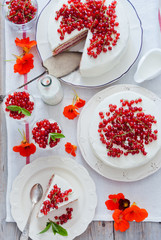 Cakes with red currant decorated with fresh red berries