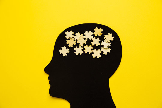 Brain disorder symbol presented by human head made form paper . Creative idea for Alzheimer's disease, dementia, memory loss and mental health concept