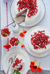 Cakes with red currant decorated with fresh red berries