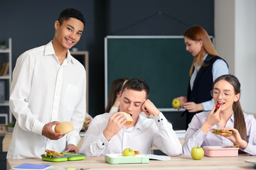 Pupils having lunch in classroom