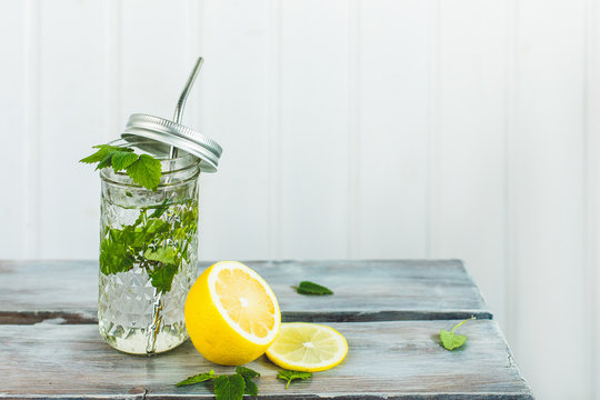 Fresh drink whith lemon and minton white background., refreshment