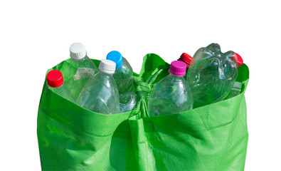 plastic bottles in a recycling bag. isolated on a white background. the concept of ecology